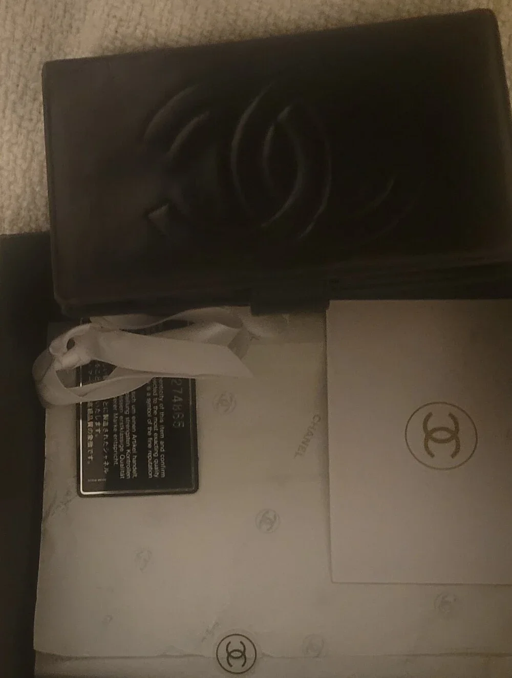 CHANEL Black Quilted Leather Wallet with Unbranded Pearl-Embellished Chain